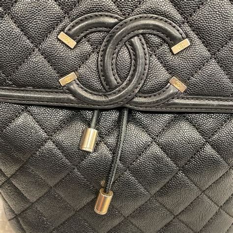 Chanel black caviar filigree backpack with matte gold hardware